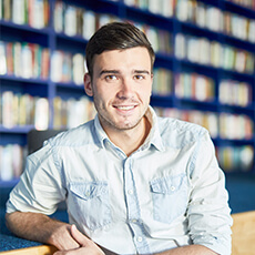 Man Sitting In A Library